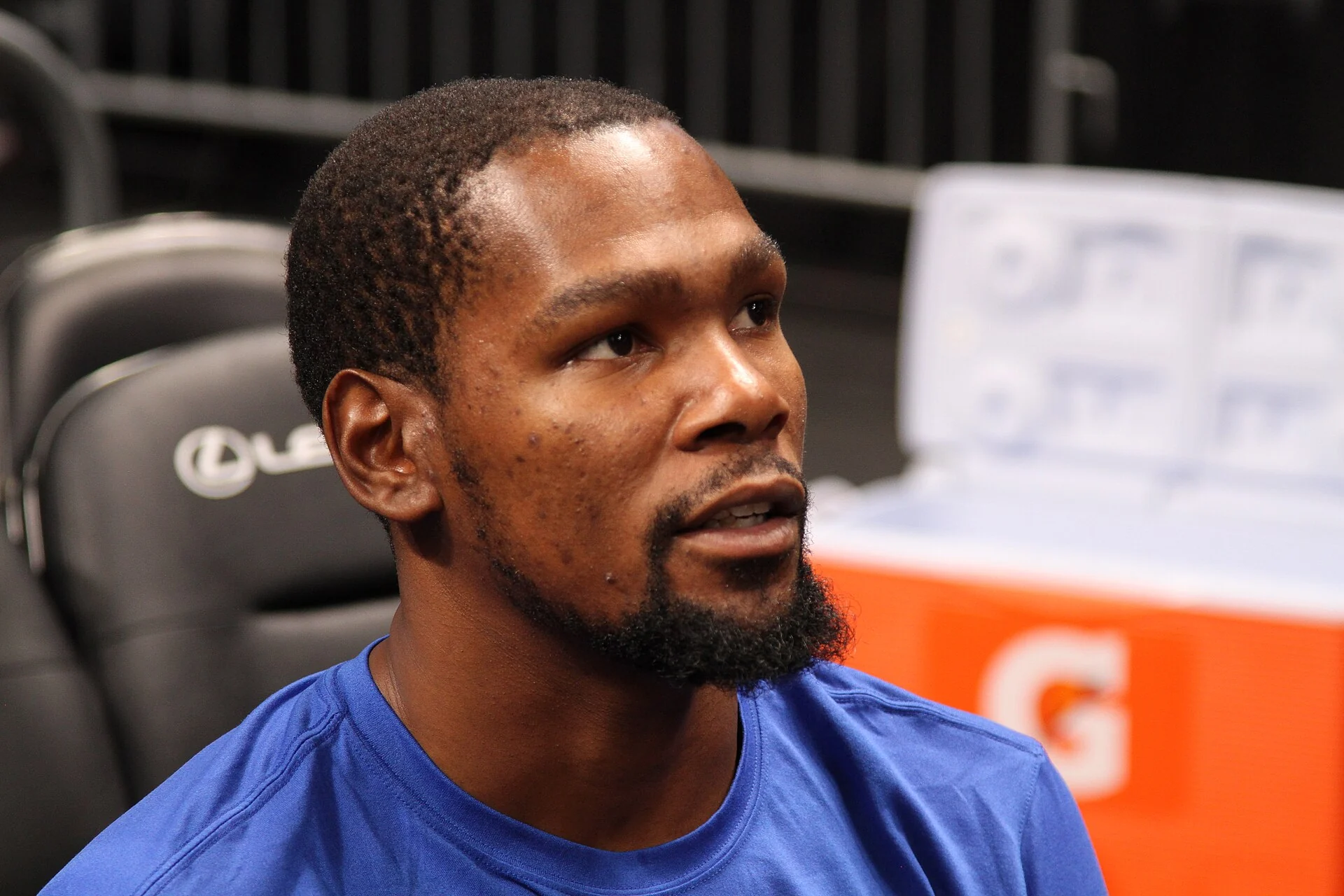 A Golden State Warriors player controls the ball during an NBA game.