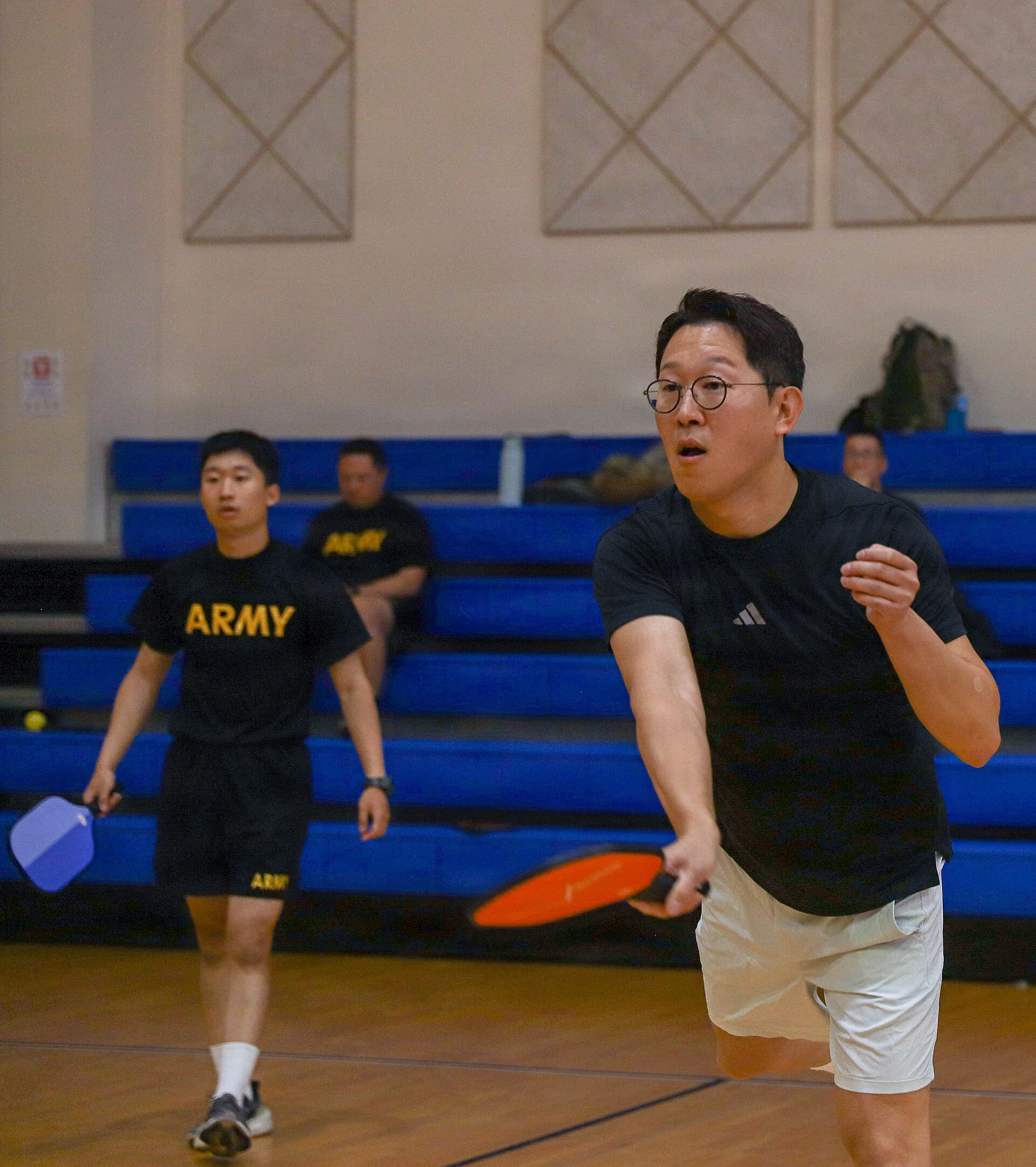 Players compete in a doubles pickleball match during KATUSA Friendship Week.