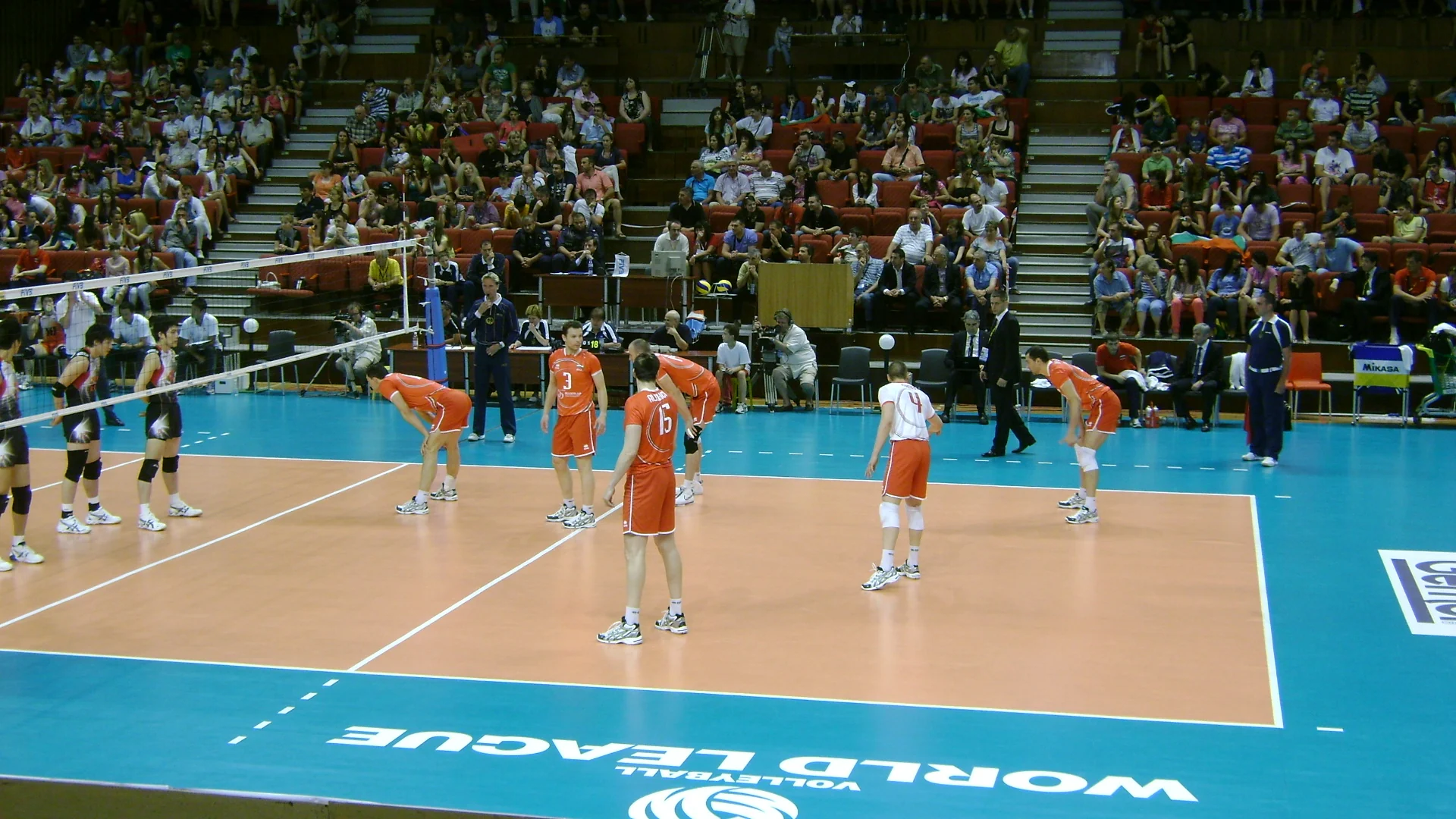 Bulgaria players compete against Japan in international volleyball.