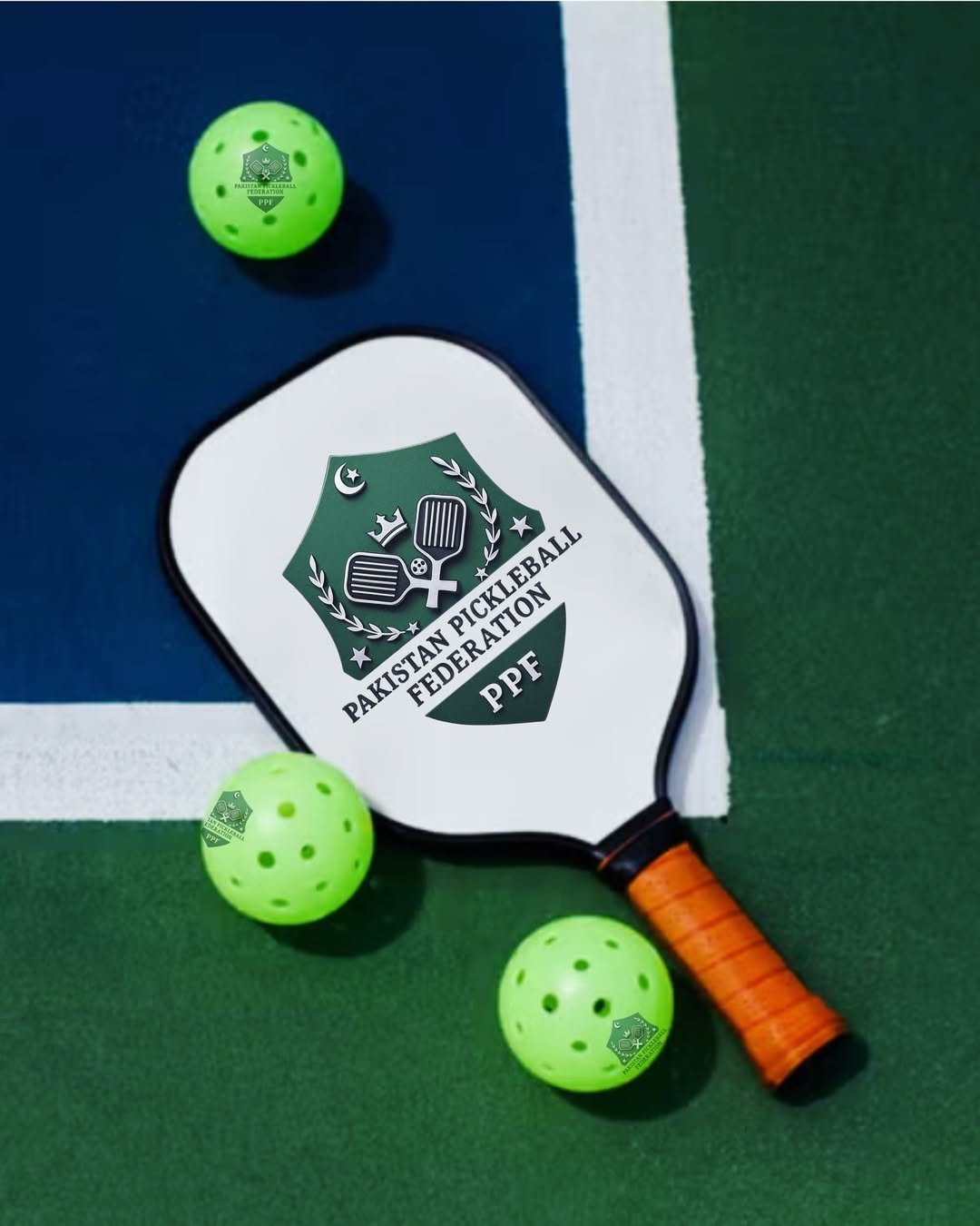 A modern raw-carbon pickleball paddle displayed against a clean background.