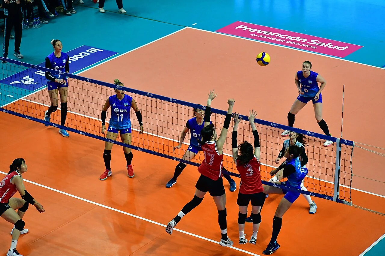 Argentina and South Korea contest an international women's volleyball match.