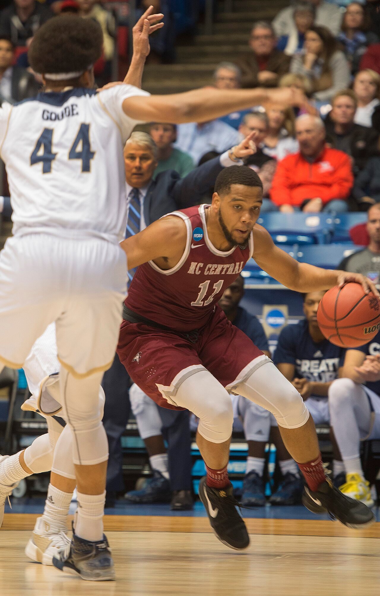 College basketball teams compete during an NCAA First Four game.