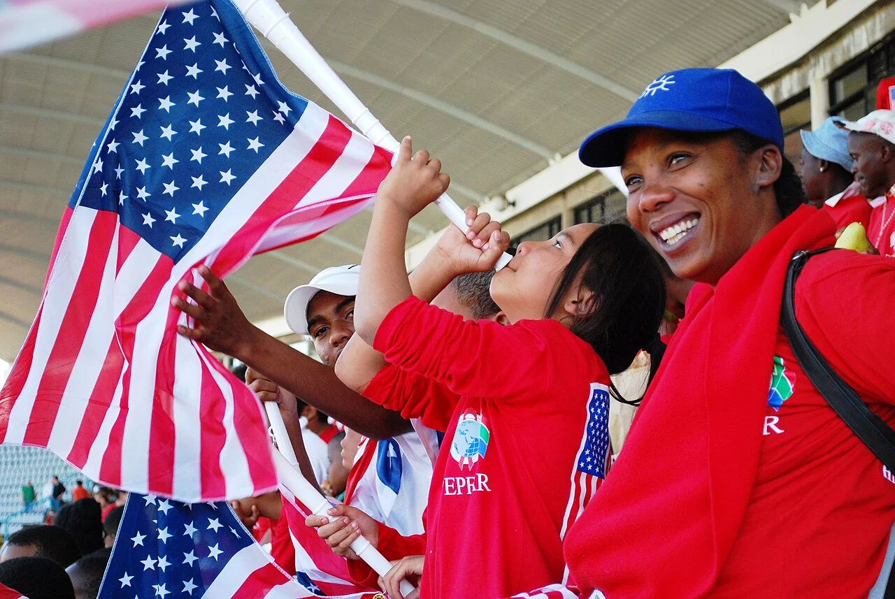 Supporters cheer for the United States national soccer team at a public viewing event.