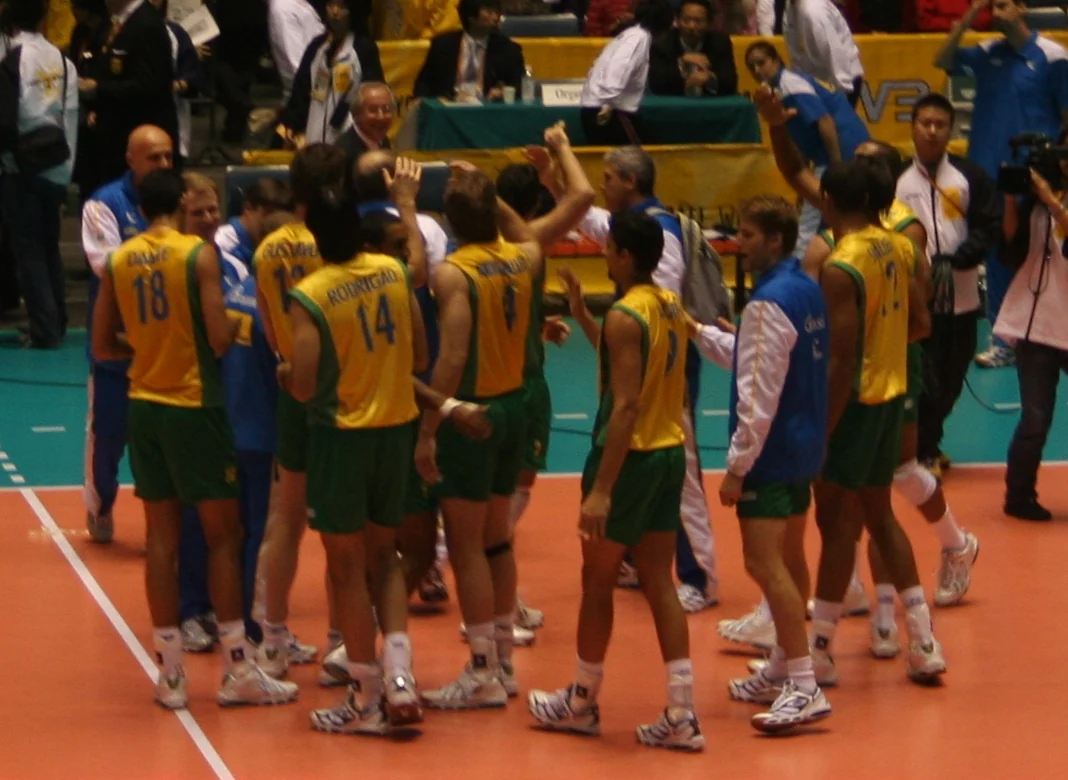 Brazil women's volleyball players celebrate after an international match in Japan.