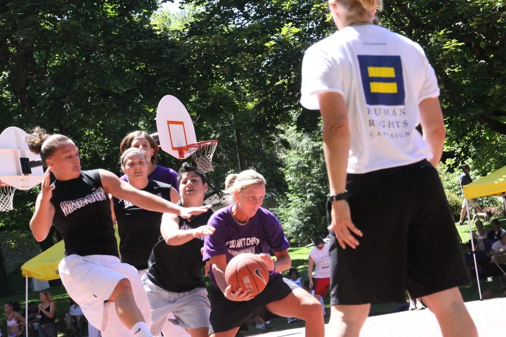 Women's teams contest an outdoor 3x3 basketball tournament.