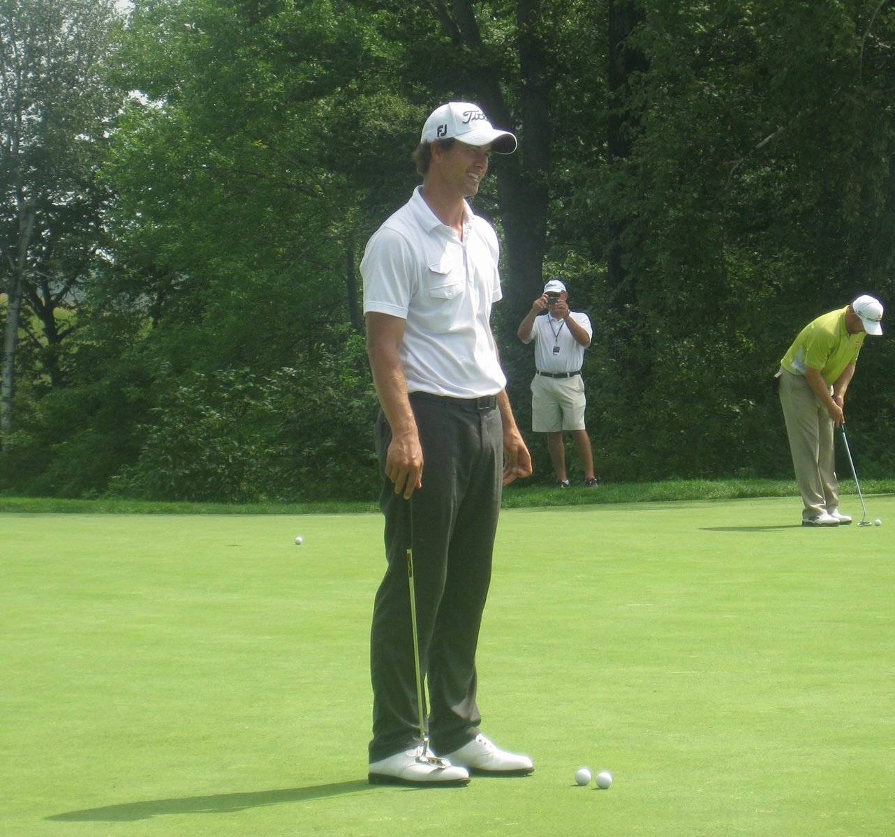 A professional golfer plays an approach shot during a major championship.