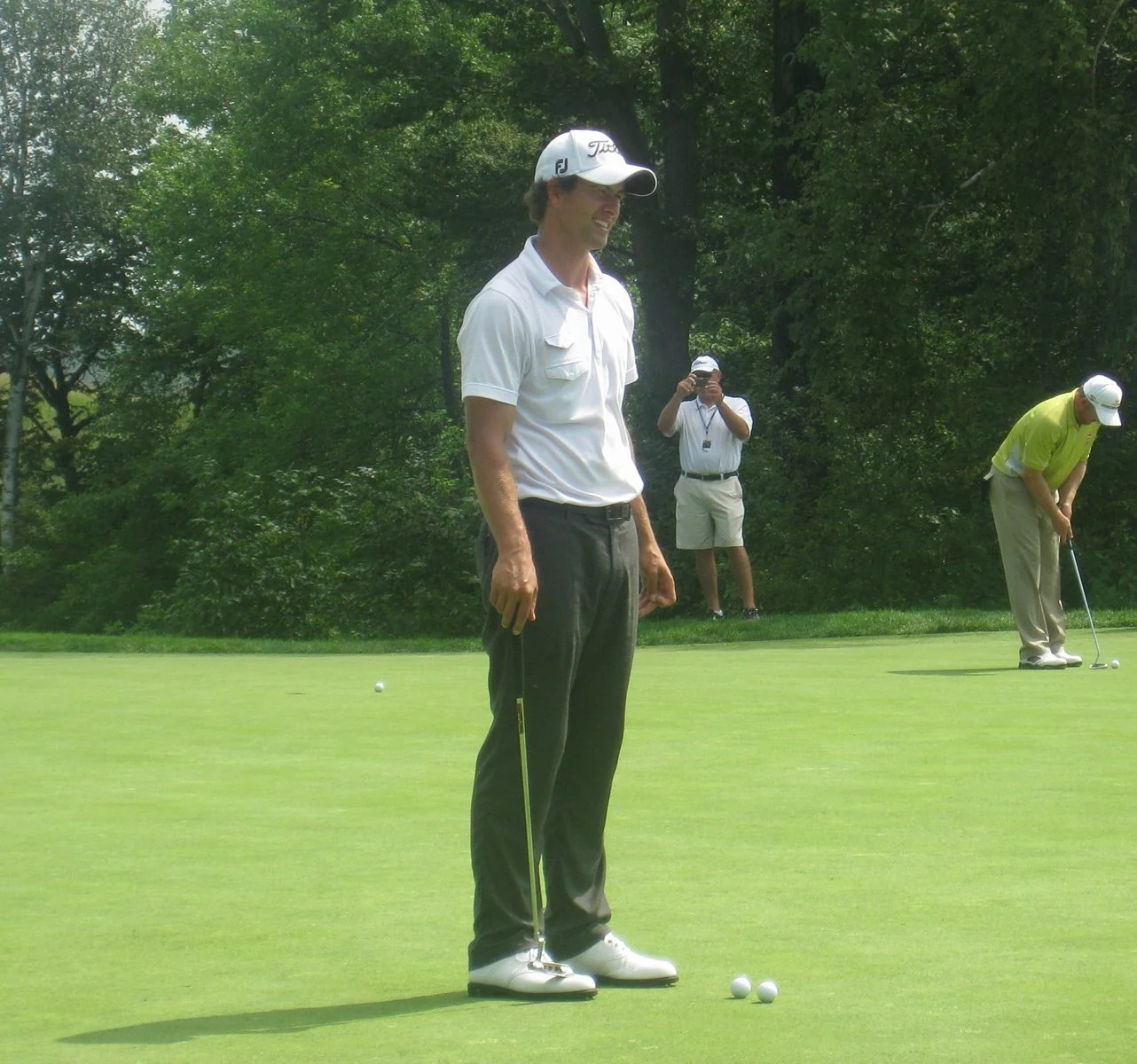 A professional golfer plays an approach shot during a major championship.