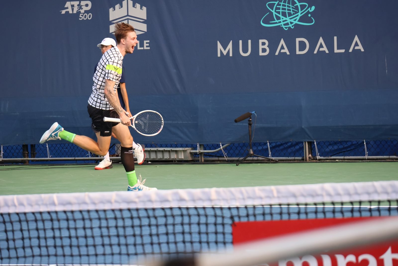 Alexander Bublik prepares to return during a professional tennis match.