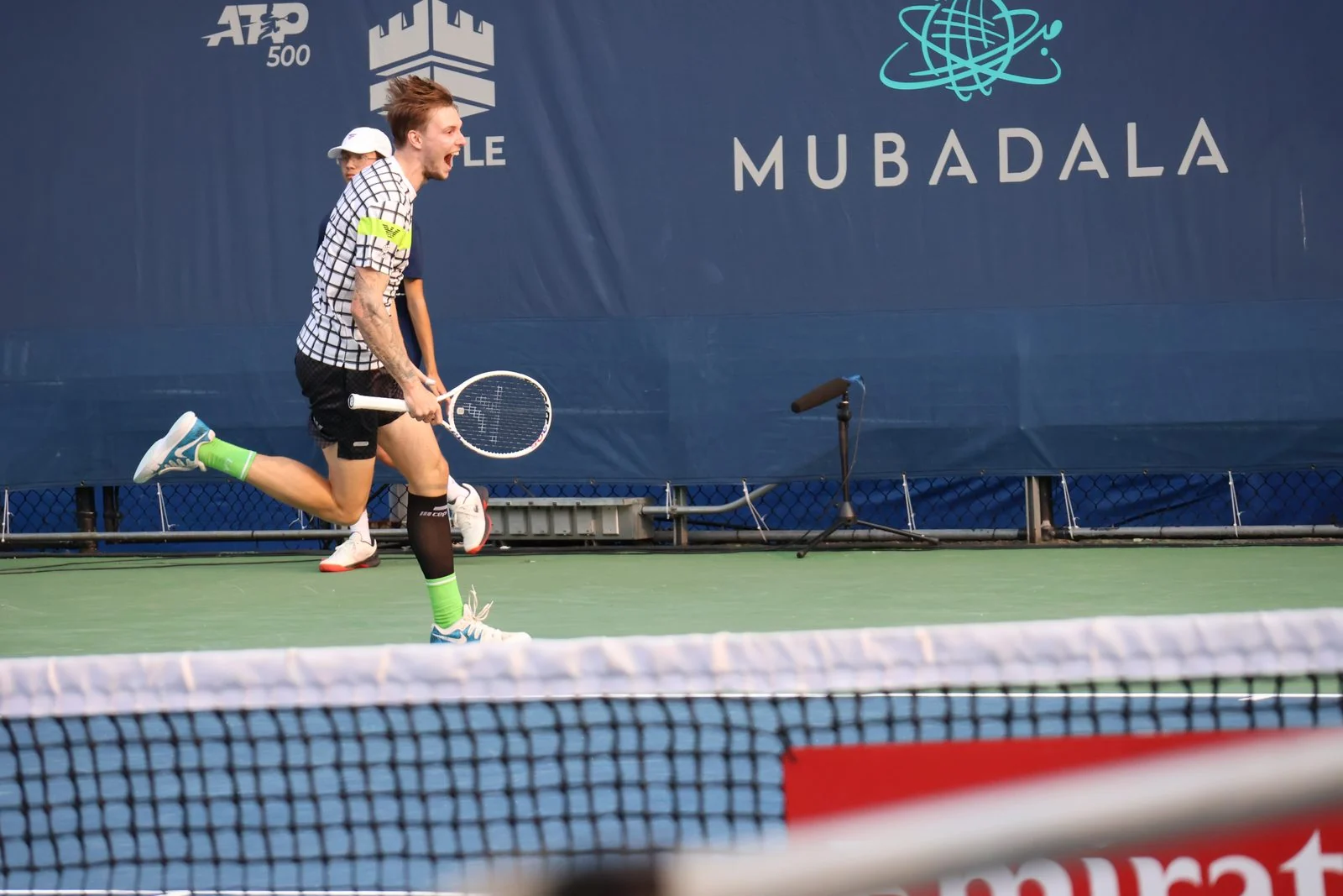 Alexander Bublik prepares to return during a professional tennis match.