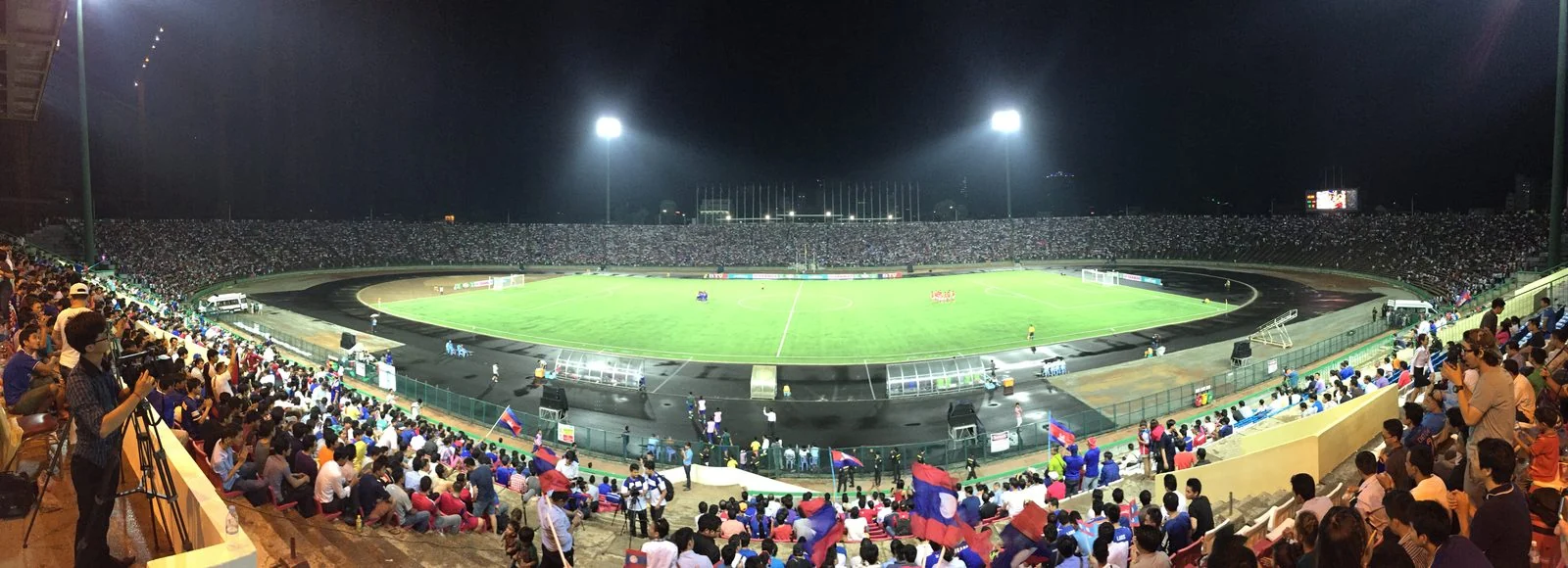 A football match is played at the Olympic Stadium in Phnom Penh.