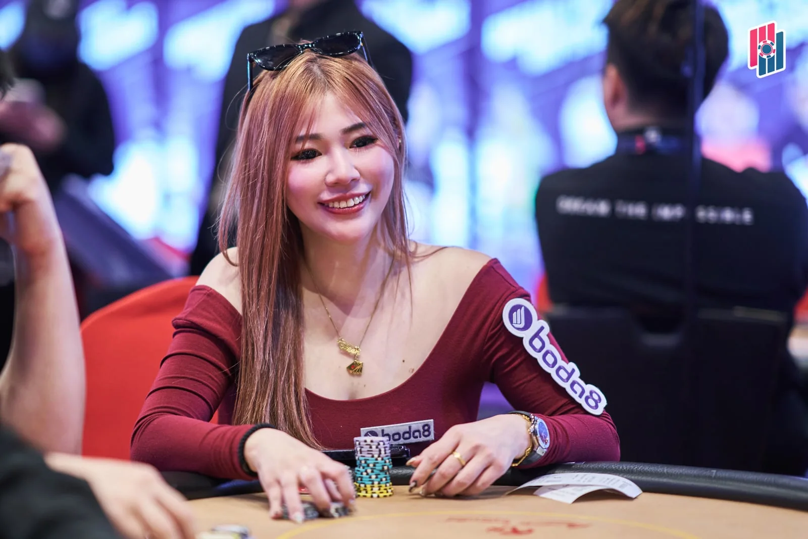 Aw Ee Ling smiling at a Poker Dream 26 table.
